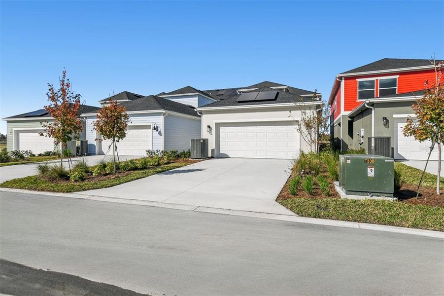 Front exterior of a new home in Laureate Park at Lake Nona - Garden Series, Orlando, FL, highlighting curb appeal (Image 21).