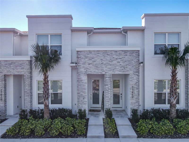 Front exterior of a new home in , Clermont, FL, highlighting curb appeal (Image 1). Front exterior of a new home in , Clermont, FL, highlighting curb appeal (Image 1).