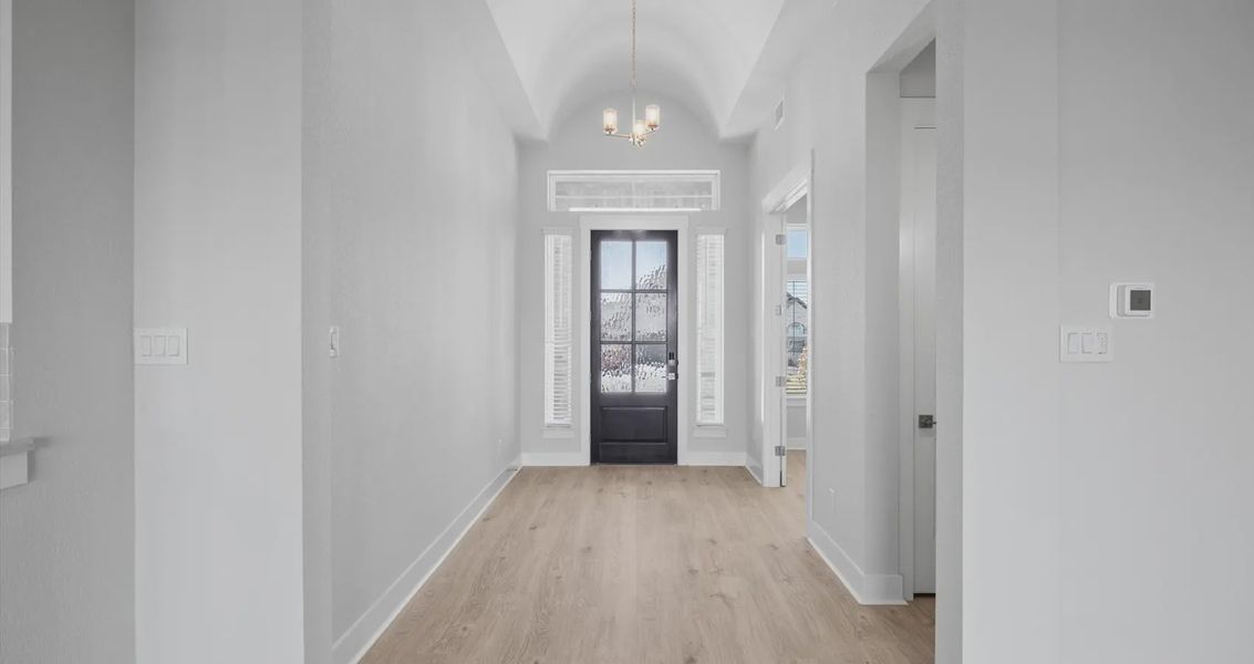 Representative unfurnished interior of a home built from the Raegan by Chesmar Homes in Sweetwater, Austin (Image 7).