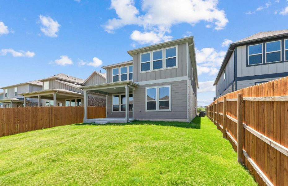 Front exterior of a new home in Saddleback at Santa Rita Ranch, Liberty Hill, TX, highlighting curb appeal (Image 19).