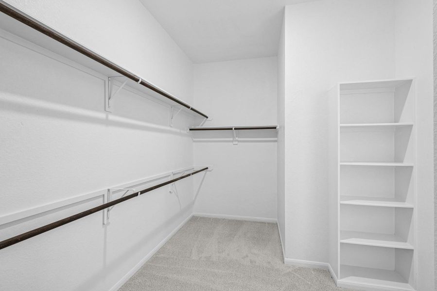 Large walk-in closet in the primary suite Large walk-in closet in the primary suite