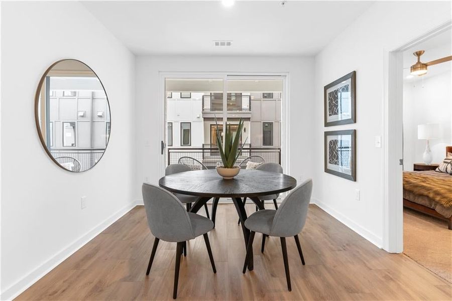 Dining area leads to the balcony *Images from the model, not the subject property*