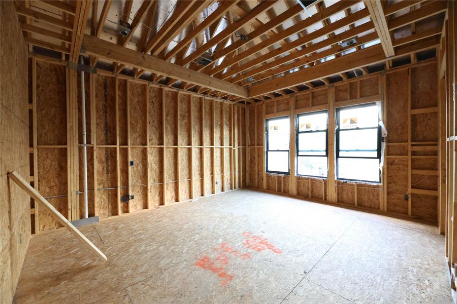 Primary Suite located on the 2nd floor features 3 large Andersen windows, wood floors and large spa-like bathroom w/ soak tub and separate walk-in shower.