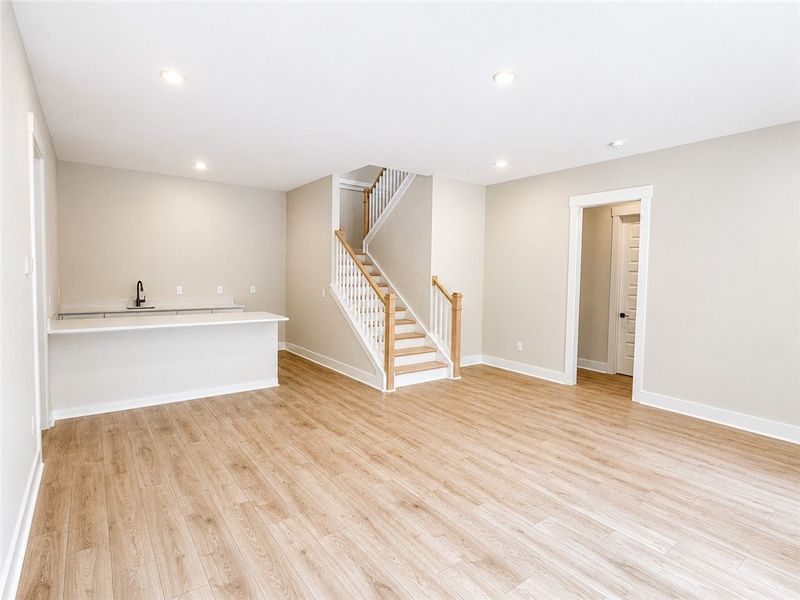 A spacious, naturally illuminated room featuring a