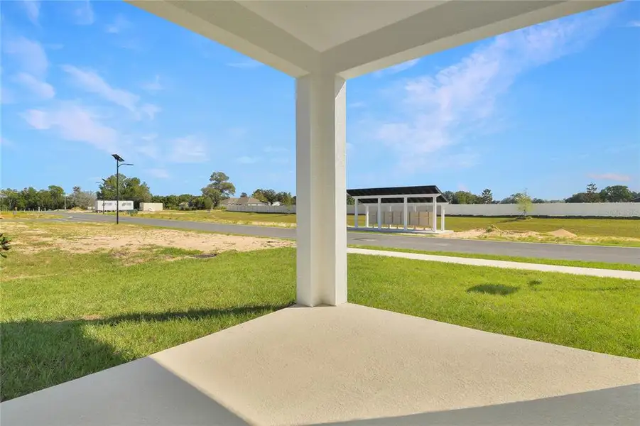 Exterior details and patio area of a home in Seasons at Aurora Oaks, Ocala (Image 4).