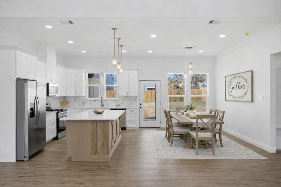 Impressive chef’s kitchen with quartz countertops, expansive island, and refined modern finishes.