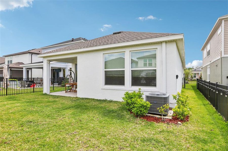 Exterior details and patio area of a home in Waterset Garden Series, Apollo Beach (Image 33).