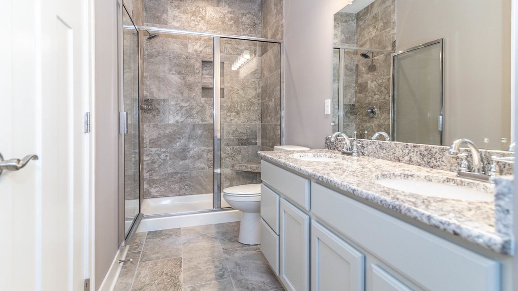 Representative furnished interior of a home built from the The Boulder Side Entry by Norfolk Homes in The Grande Estates, Jackson (Image 12).