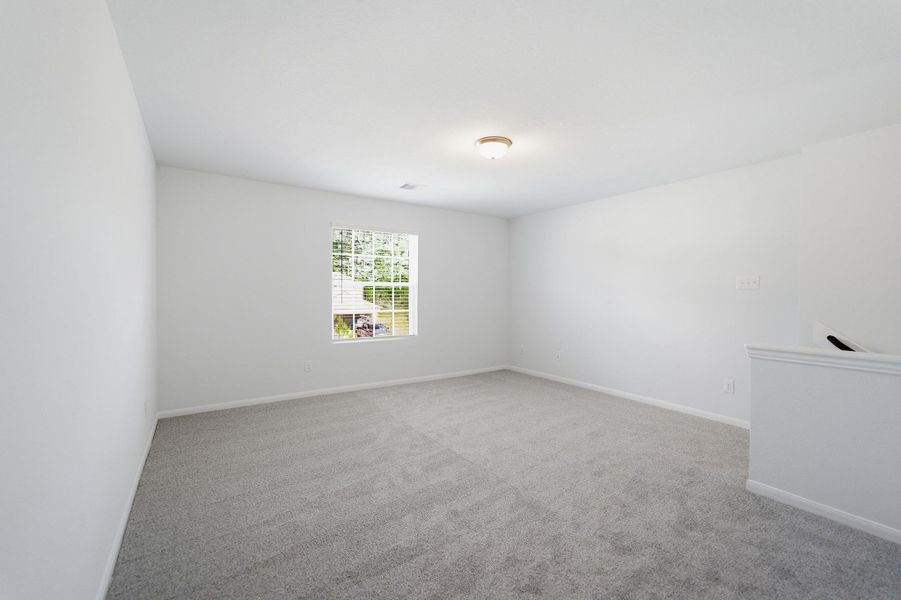 Spacious, unfurnished interior of a new home in The Pines at Seven Coves, Willis (Image 27).
