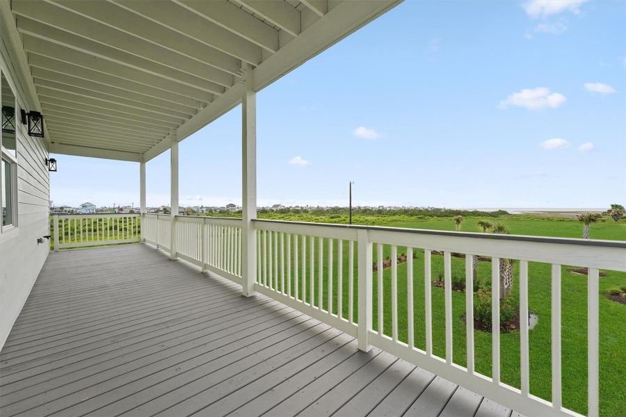 Covered back deck with unobstructed views of the bay and no rear neighbors—this is peaceful coastal living at its best. Covered back deck with unobstructed views of the bay and no rear neighbors—this is peaceful coastal living at its best.