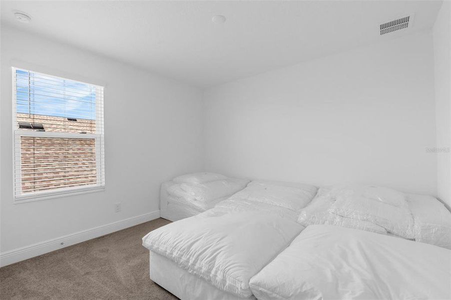 Furnished interior view inside a new home in Ridgeview, Clermont (Image 12).