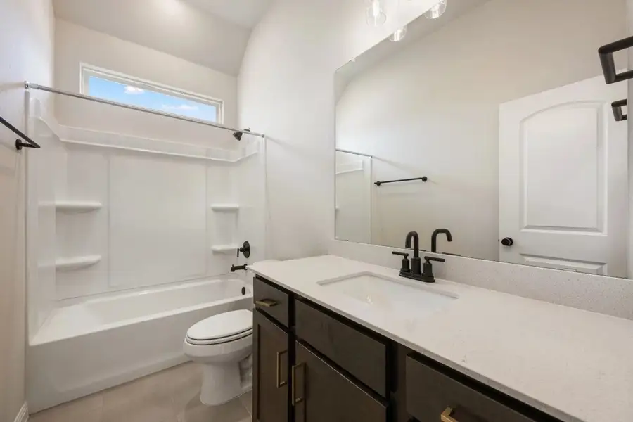 Furnished interior view inside a new home in The Colony 50s, Bastrop (Image 5).