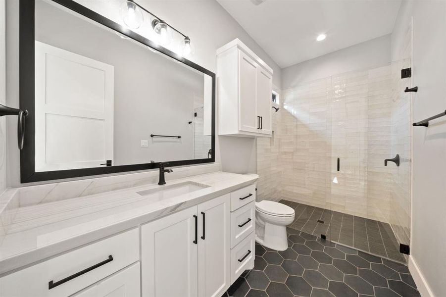 3rd bedroom's bathroom with 84" frameless shower door and framed mirror.