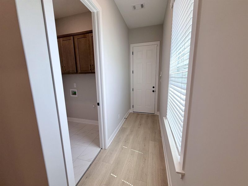 Located off garage entry