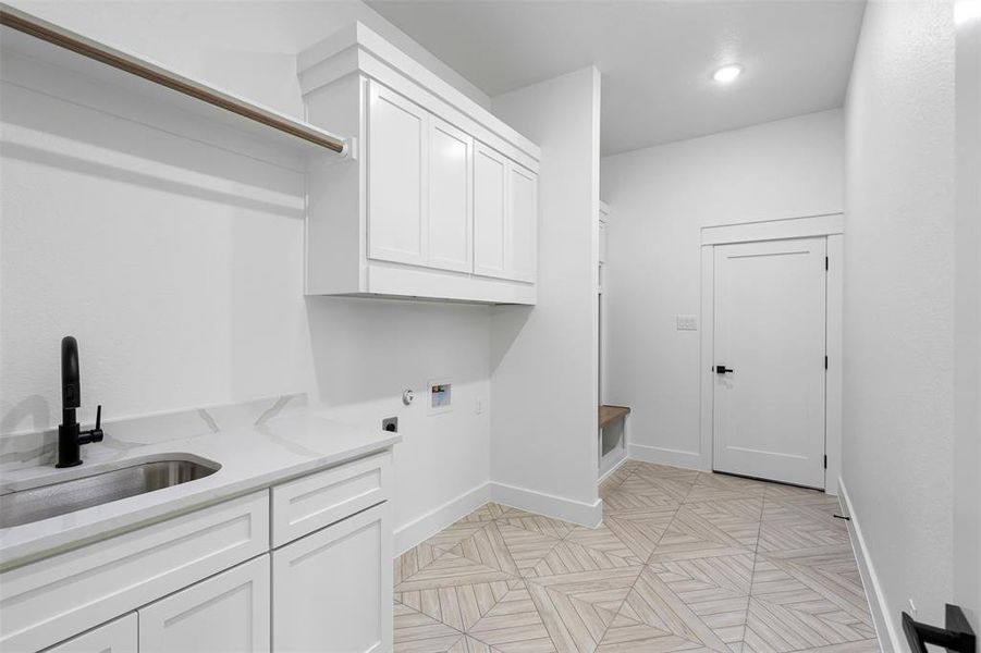 Unfurnished room with light carpet, ceiling fan, and beam ceiling