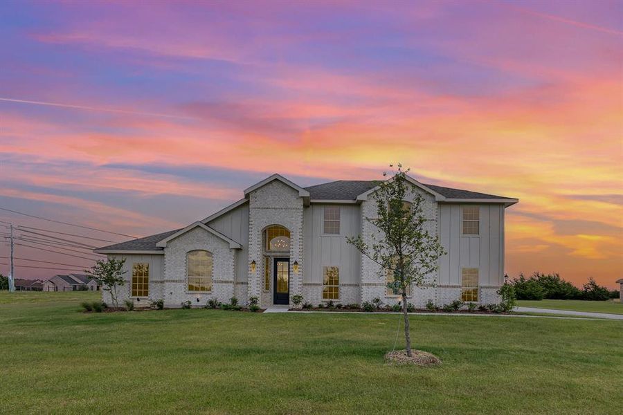 Front exterior of a new home in Sagebrush Addition, Midlothian, TX, highlighting curb appeal (Image 17).