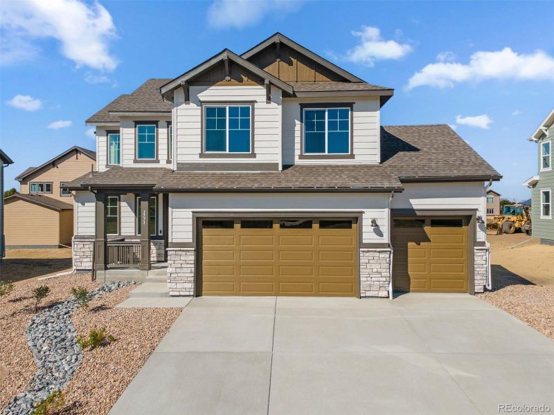 Front exterior of a new home in Cherry Meadows, Brighton, CO, highlighting curb appeal (Image 2).