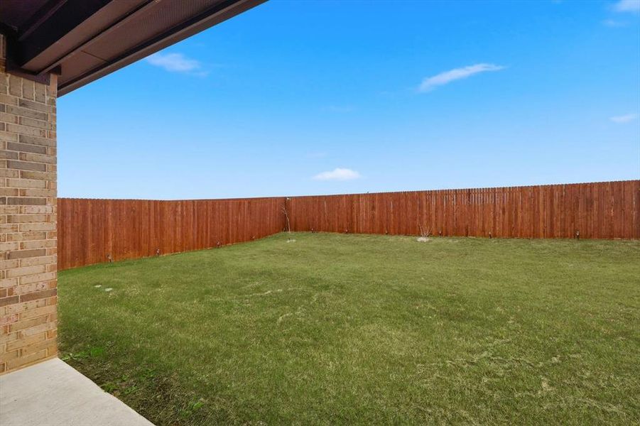 Fenced backyard featuring a patio area
