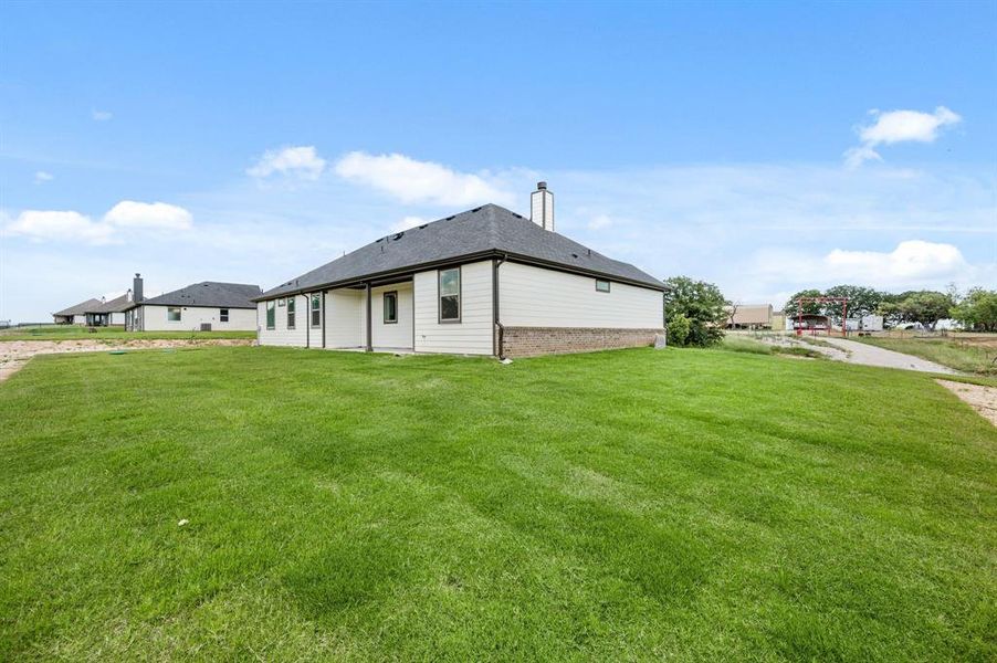 Front exterior of a new home in Saddleback Estates, Boyd, TX, highlighting curb appeal (Image 22).