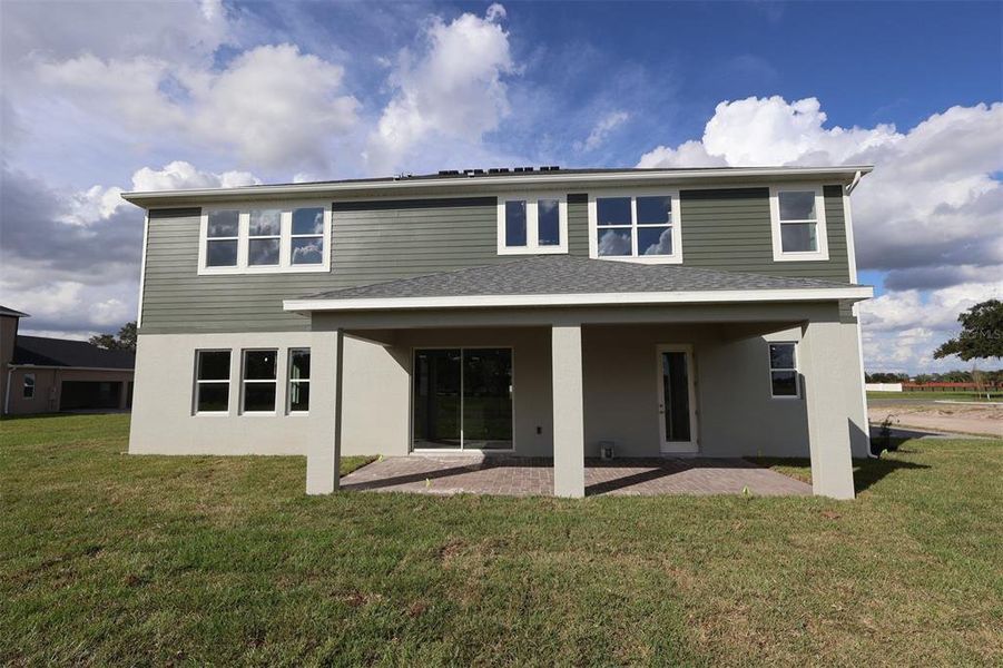 Exterior details and patio area of a home in Solace at Corner Lake, Orlando (Image 3). Exterior details and patio area of a home in Solace at Corner Lake, Orlando (Image 3).