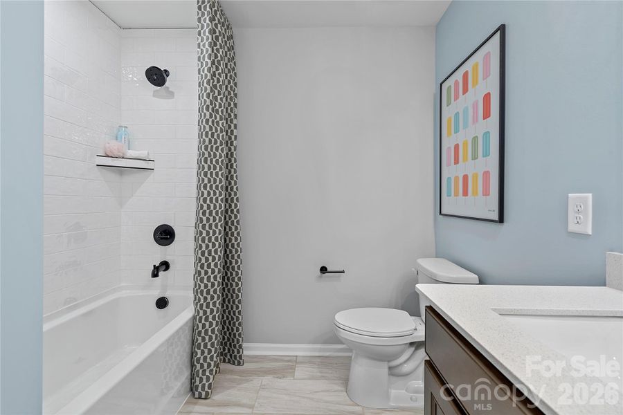 Secondary bathroom with upgraded modern shower tile. Secondary bathroom with upgraded modern shower tile.