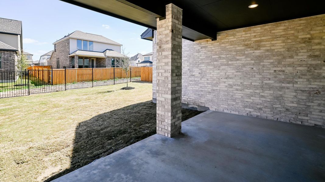 Exterior details and patio area of a home in 6 Creeks, Kyle (Image 4).