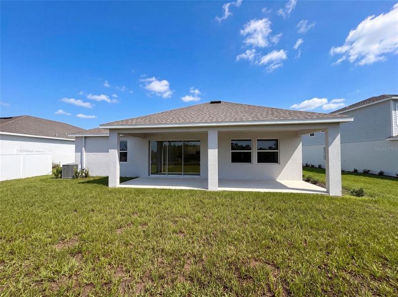 Exterior details and patio area of a home in Meadow Pointe, Groveland (Image 3).