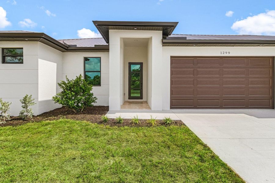 Front exterior of a new home in , Labelle, FL, highlighting curb appeal (Image 19). Front exterior of a new home in , Labelle, FL, highlighting curb appeal (Image 19).