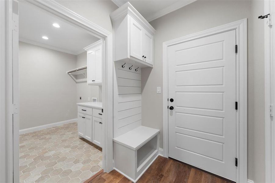 Mudroom with crown molding, recessed lighting, baseboards, and wood finished floors