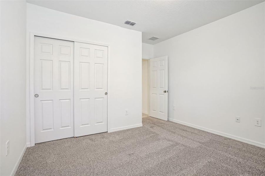 Spacious, unfurnished interior of a new home in Lake Deer Estates - Signature Series, Poinciana (Image 20). Spacious, unfurnished interior of a new home in Lake Deer Estates - Signature Series, Poinciana (Image 20).