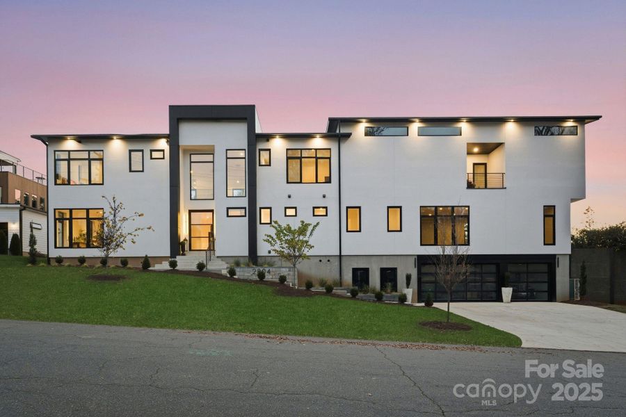 Front exterior of a new home in , Charlotte, NC, highlighting curb appeal (Image 1).
