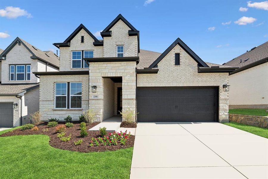 Front exterior of a new home in Pecan Square - Gardens, Northlake, TX, highlighting curb appeal (Image 23). Front exterior of a new home in Pecan Square - Gardens, Northlake, TX, highlighting curb appeal (Image 23).