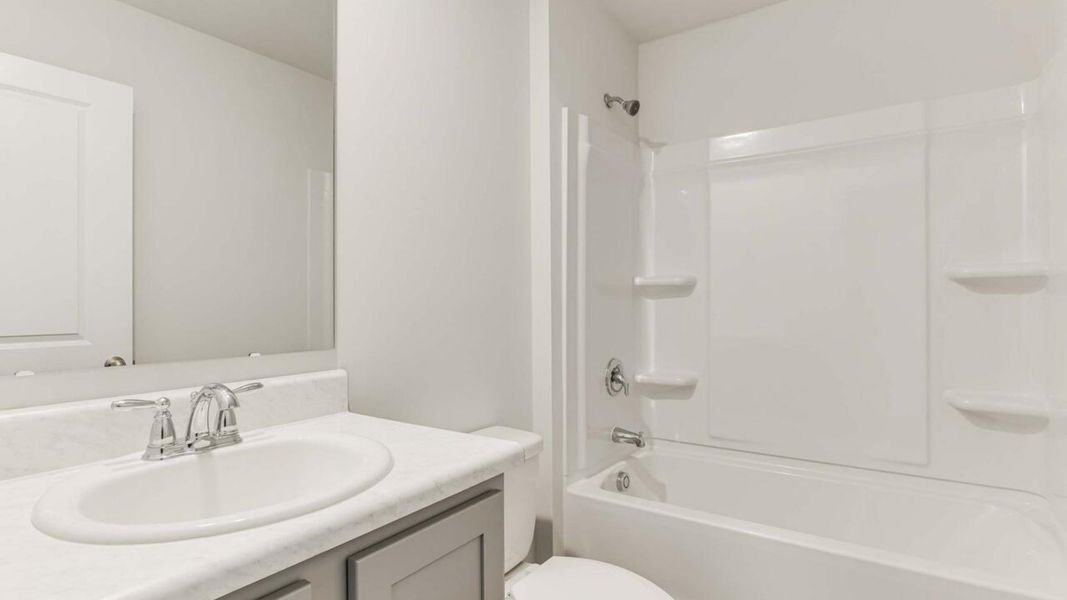 Representative furnished interior of a home built from the Devon by D.R. Horton in Eagle Creek, Bolivia (Image 10).