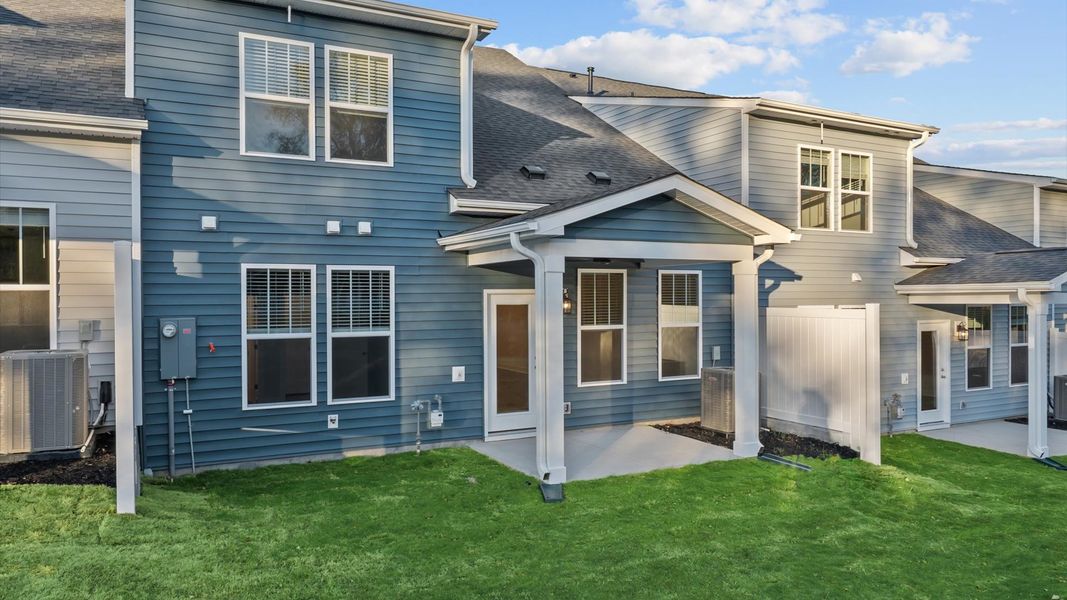 Warm and inviting outdoor living space with a covered rear porch and tasteful finishes Warm and inviting outdoor living space with a covered rear porch and tasteful finishes