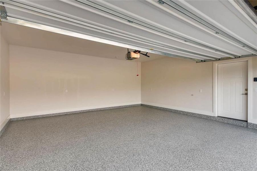 Enormous garage with garage door opener and electric car plug option. Epoxy is an upgrade. Enormous garage with garage door opener and electric car plug option. Epoxy is an upgrade.