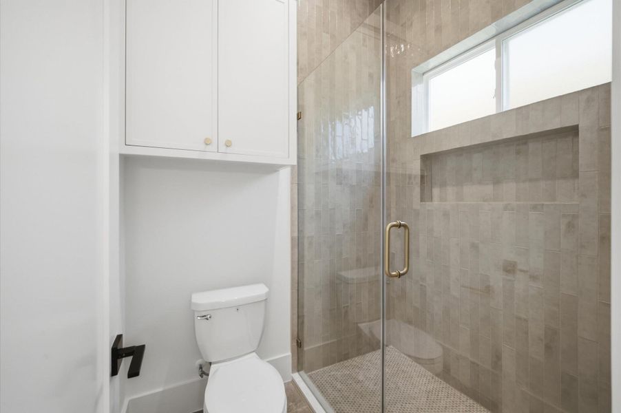Full bathroom with a shower for the guest suite or optional study.