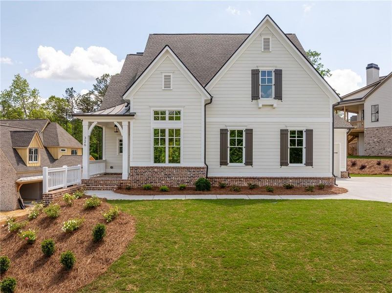 Front exterior of a new home in Malone's Pond, Ball Ground, GA, highlighting curb appeal (Image 2).
