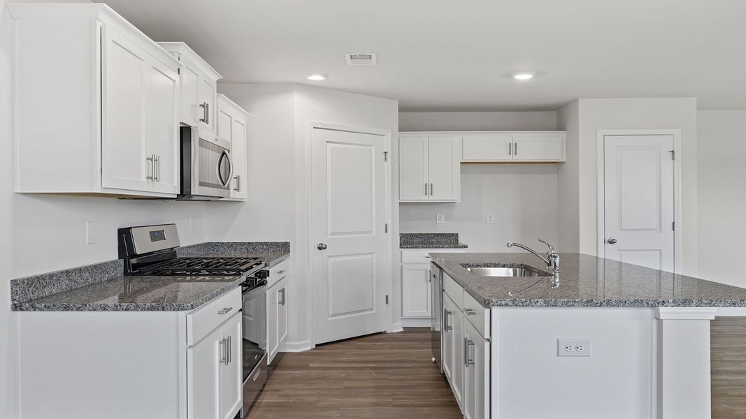 Furnished interior view inside a new home in Village Grove, Greenville (Image 5).