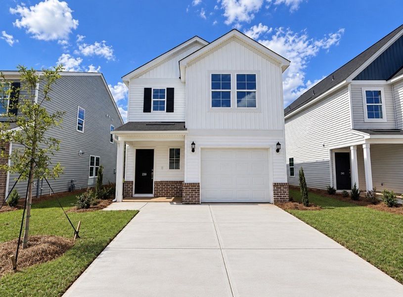 Front exterior of a new home in Laurinton Farms, Hopkins, SC, highlighting curb appeal (Image 1). Front exterior of a new home in Laurinton Farms, Hopkins, SC, highlighting curb appeal (Image 1).