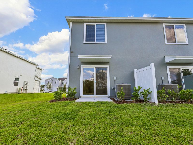 Exterior details and patio area of a home in The District at Oakleaf - The Commons, Middleburg (Image 3).