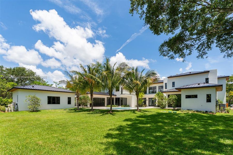 Front exterior of a new home in , Pinecrest, FL, highlighting curb appeal (Image 2).