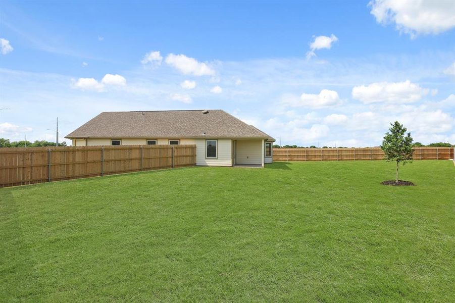 Front exterior of a new home in Rocky Creek Crossing, Fort Worth, TX, highlighting curb appeal (Image 2). Front exterior of a new home in Rocky Creek Crossing, Fort Worth, TX, highlighting curb appeal (Image 2).