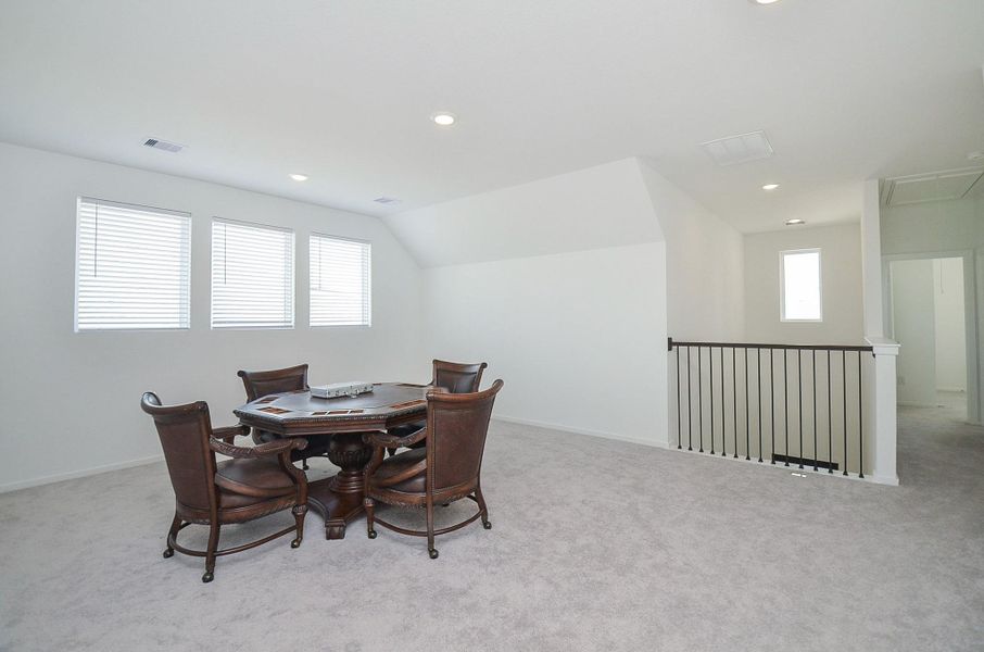 Large game room upstairs is perfectly designed for comfort and entertainment