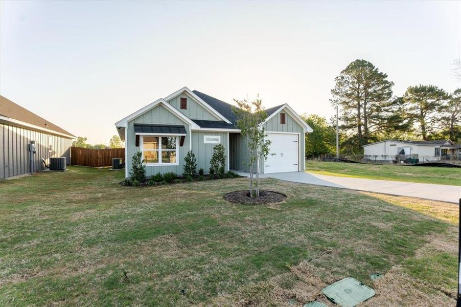 Front exterior of a new home in , Tolar, TX, highlighting curb appeal (Image 18).