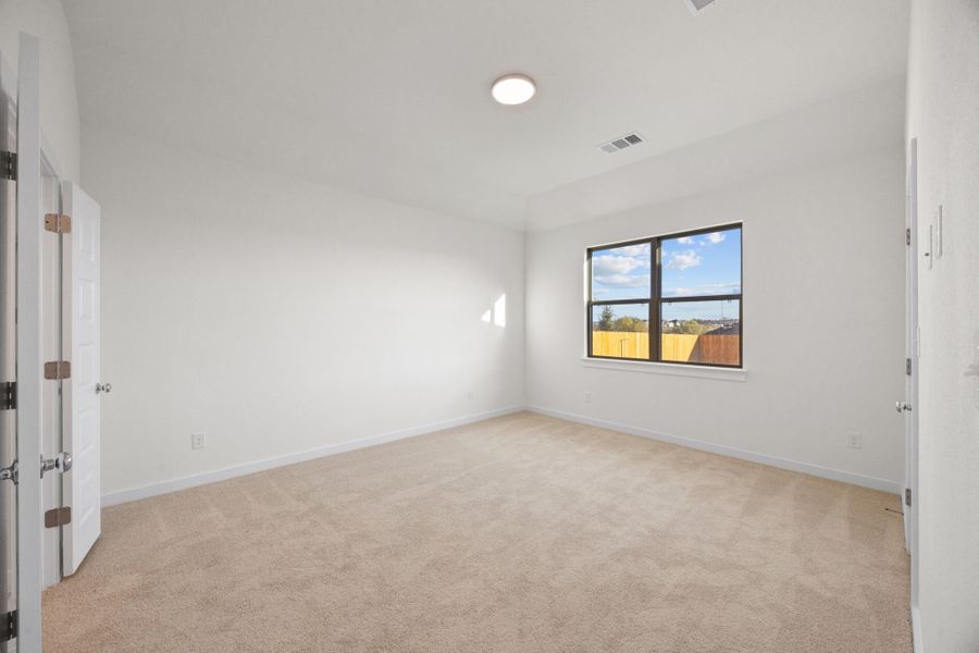 Primary Suite in the Pearl home plan by Trophy Signature Homes – REPRESENTATIVE PHOTO