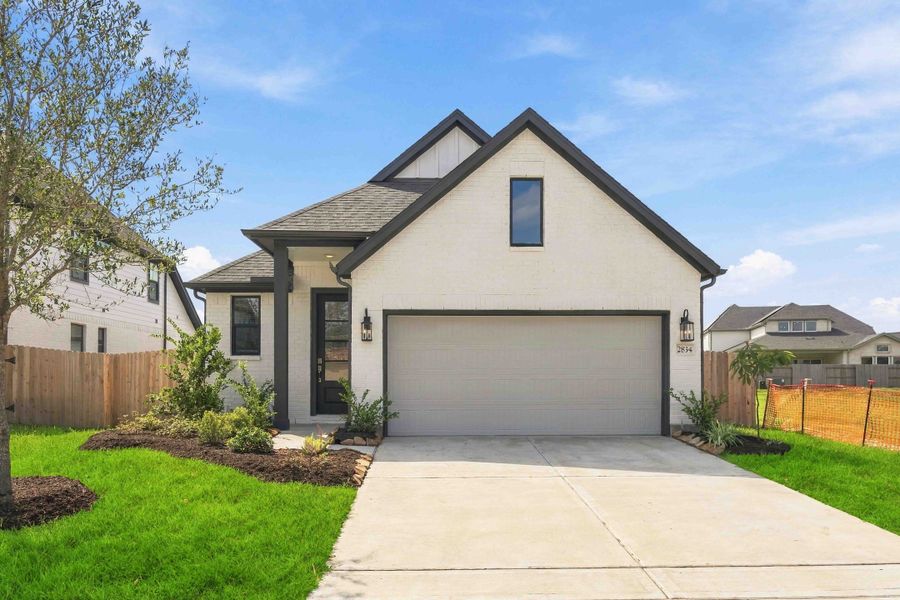 Front exterior of a new home in Ellwood, Iowa Colony, TX, highlighting curb appeal (Image 1). Front exterior of a new home in Ellwood, Iowa Colony, TX, highlighting curb appeal (Image 1).