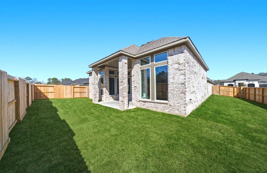 Exterior details and patio area of a home in The Highlands 55′, Porter (Image 23).