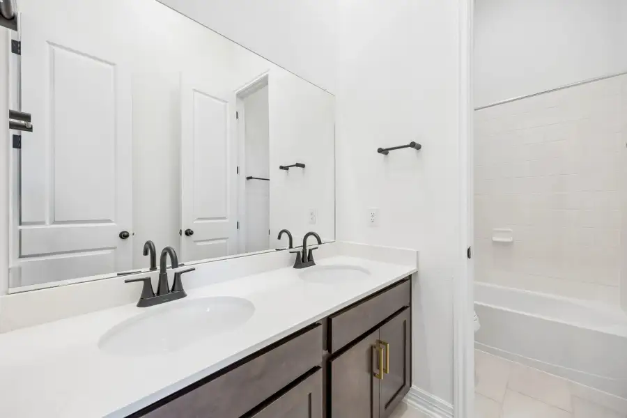 Secondary bathroom. Sample product photo. Actual exterior and interior selections may vary by homesite. Photo may be virtually staged.