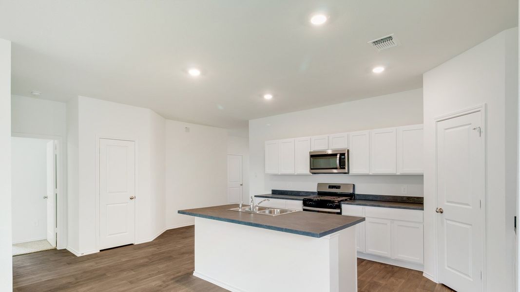 Representative furnished interior of a home built from the The Gaven by D.R. Horton in Wayside, Uhland (Image 5).