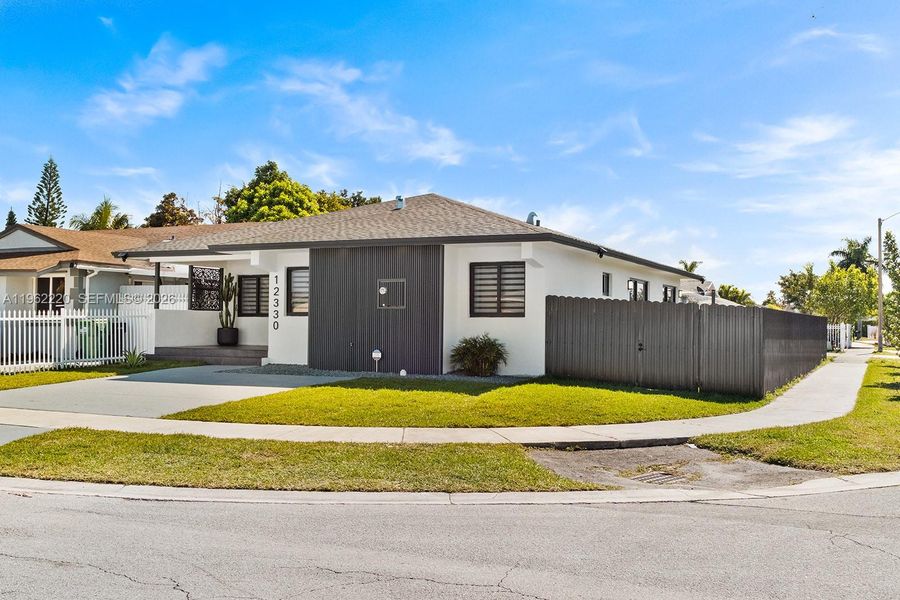 Front exterior of a new home in , Miami, FL, highlighting curb appeal (Image 1). Front exterior of a new home in , Miami, FL, highlighting curb appeal (Image 1).